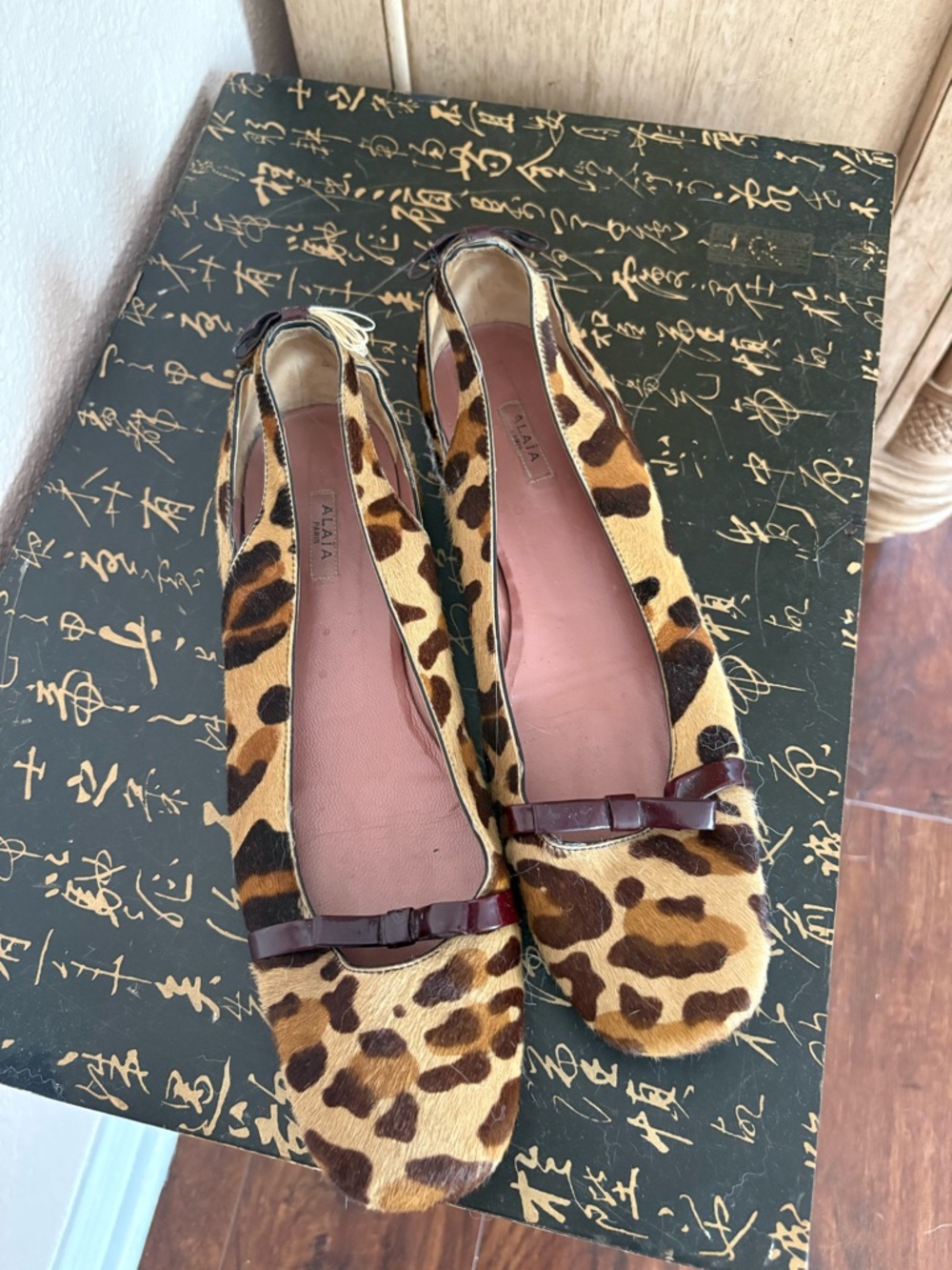 Alaia Leopard-Print Ballet Flats with Burgundy Bow
